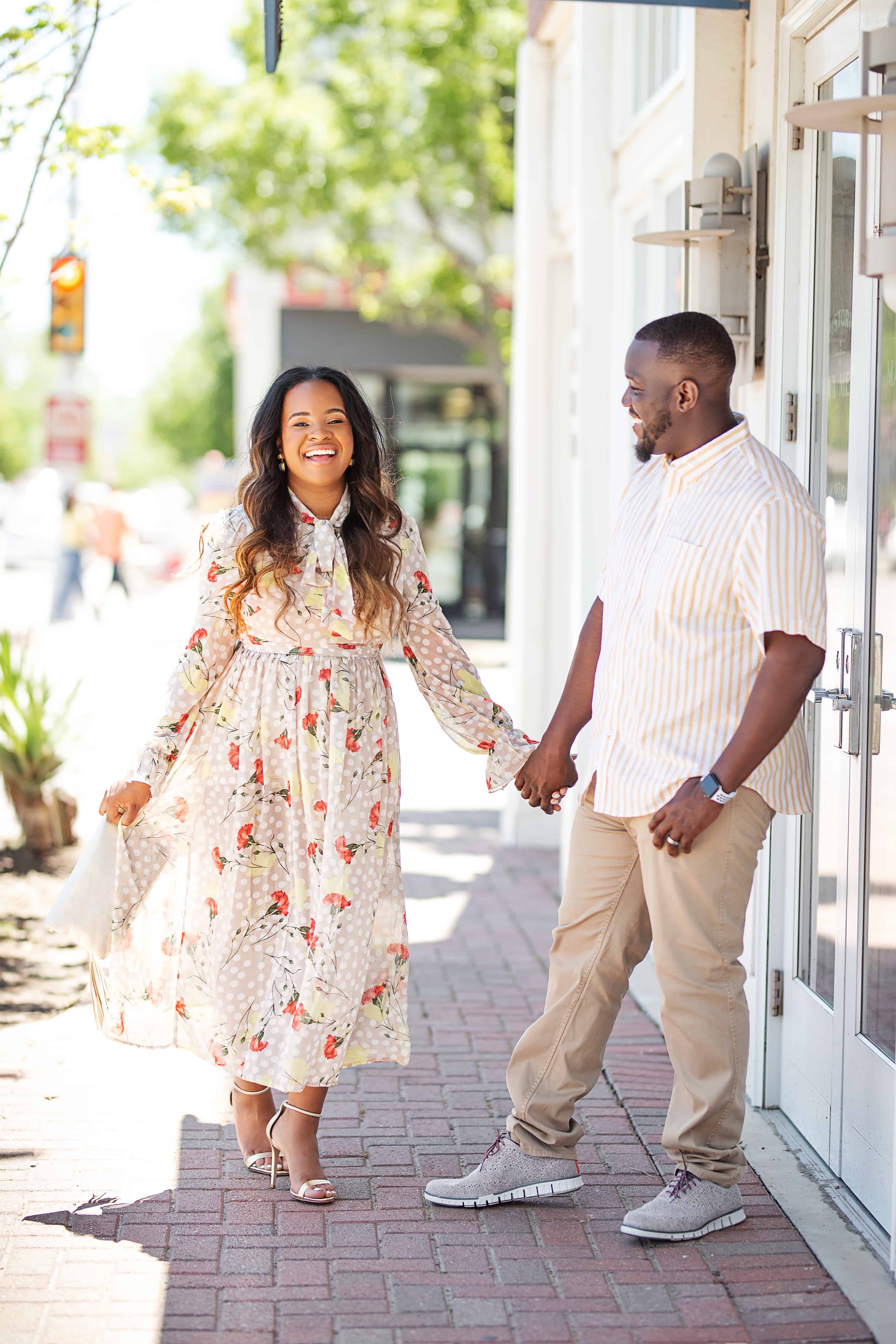 20 Cute Wedding Guest Dresses Under $50 featured by top US fashion blog, Glamorous Versatility: image of a woman wearing a floral wedding guest dress from Pretty Little Thing