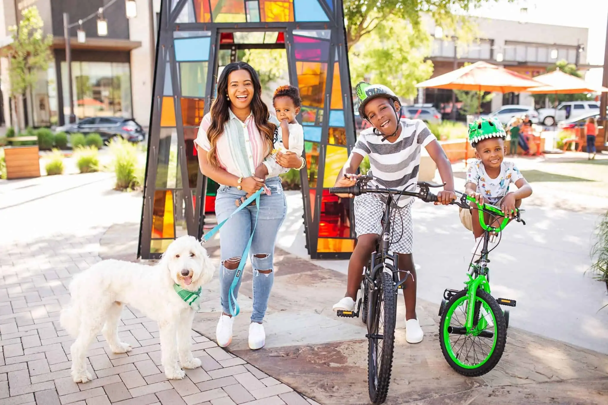 Top 40 Fun Summer Activities for Kids featured by top US life and style blog, Glamorous Versatility: image of a family going on a bike ride