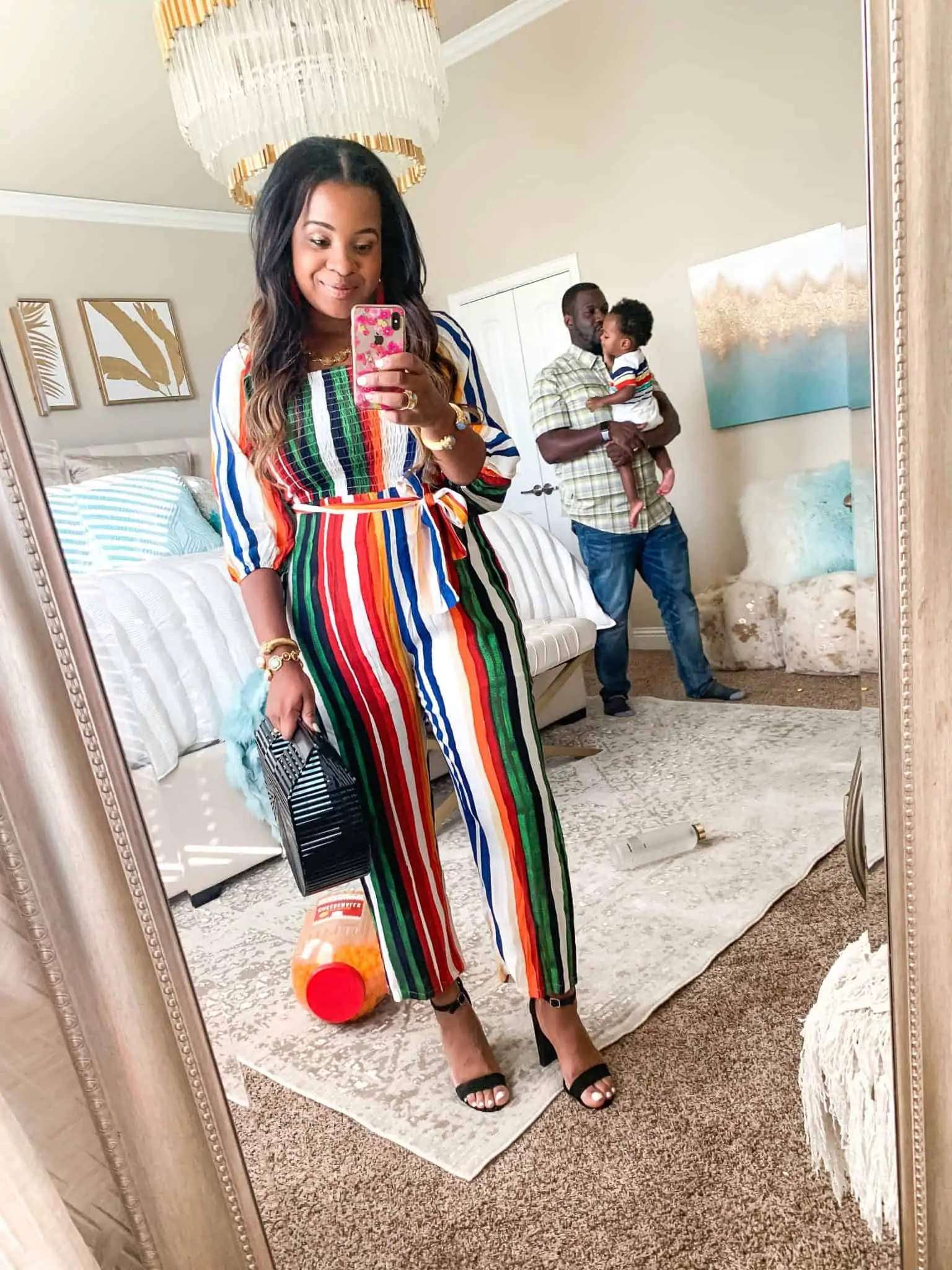 Red Dress Boutique Try-On featured by top US fashion blog, Glamorous Versatility: image of a woman wearing a Red Dress Boutique rainbow stripes jumpsuit