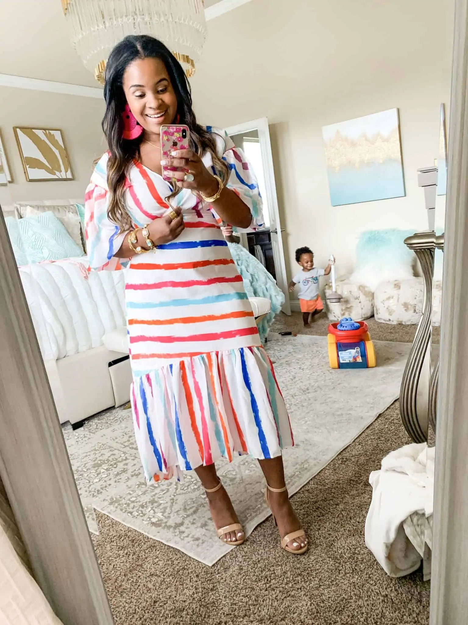 Red Dress Boutique summer favorites featured by top US fashion blog, Glamorous Versatility: image of a woman wearing a rainbow striped maxi dress