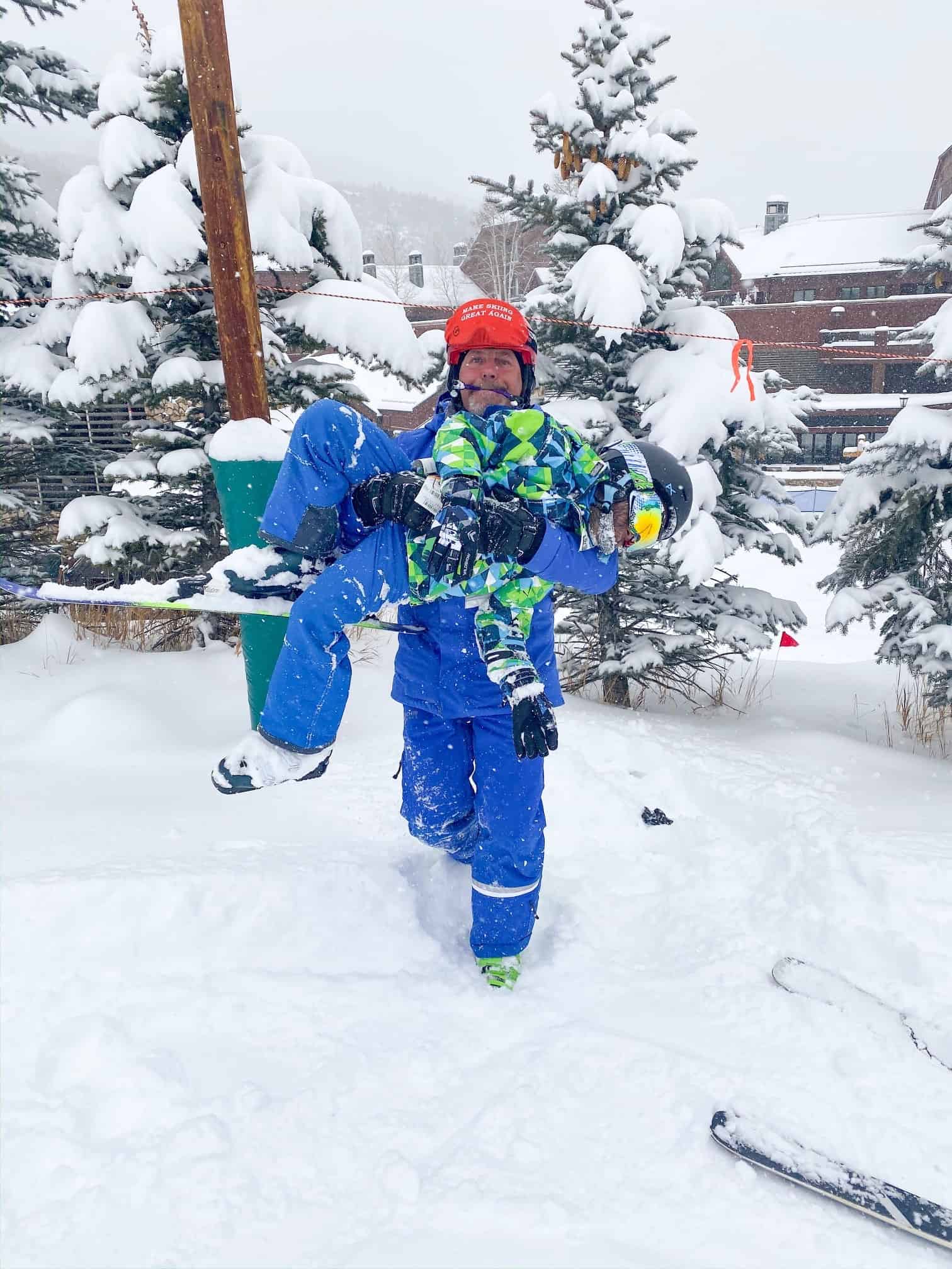 How to Plan a Ski Trip for Your Family by popular lifestyle blog, Glamorous Versatility: image of a ski instructor and a boy at Beaver Creek Ski Resort in Avon, Colorado. 