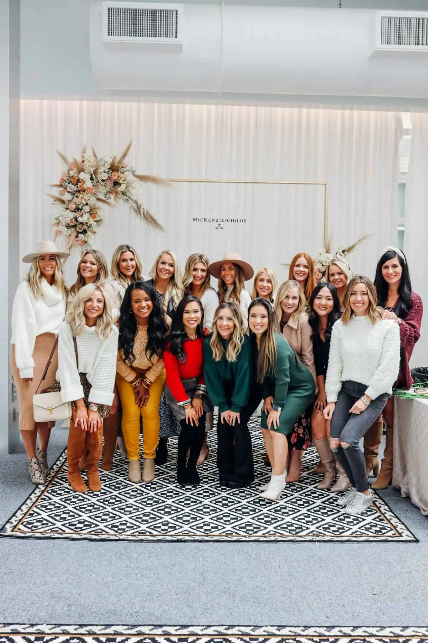 MacKenzie Childs Table Setting Ideas by popular Texas life and style blog, Glamorous Versatility: image of Texas bloggers at a MacKenzie Childs event.