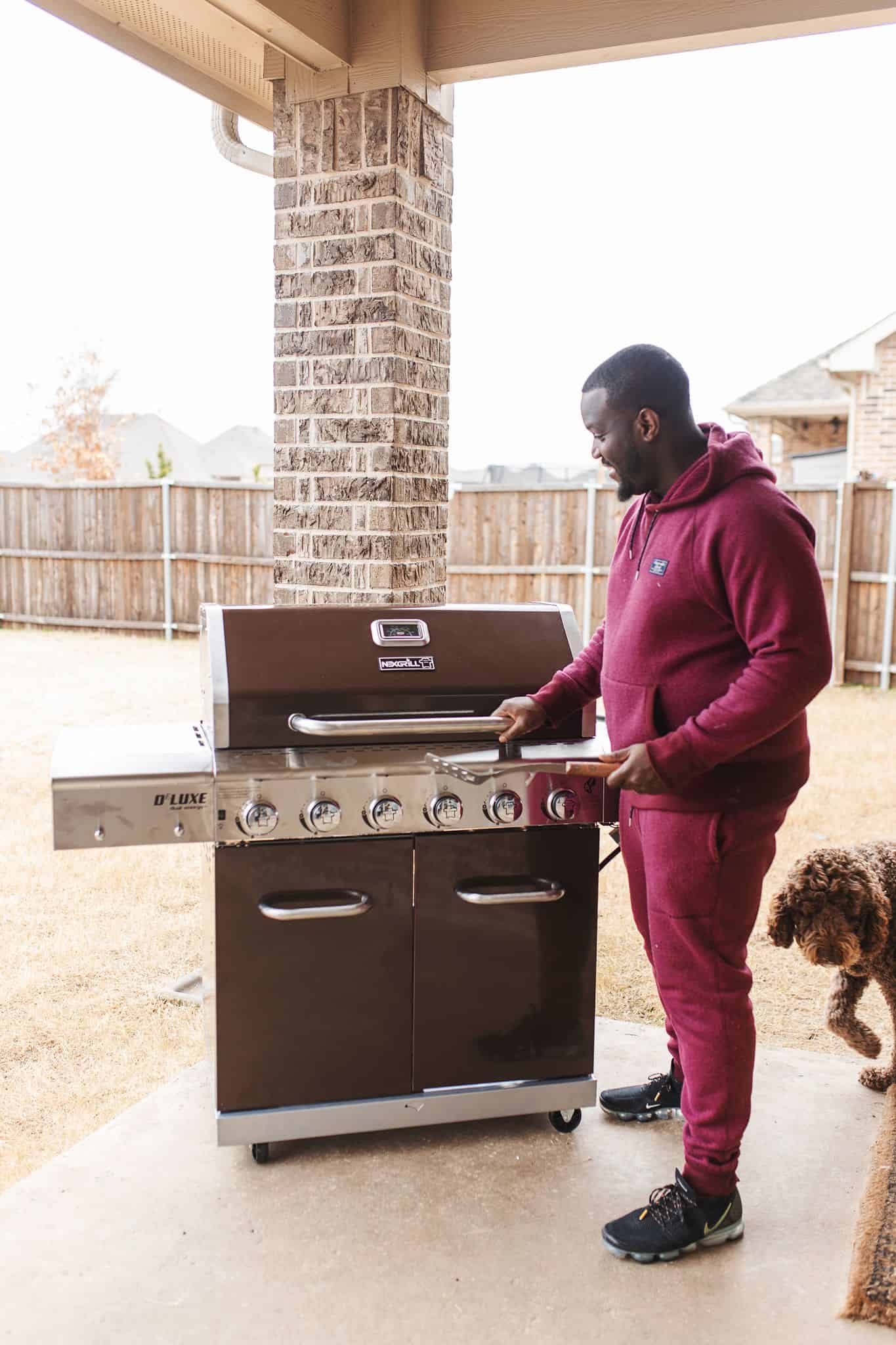 Home Depot Valentine's Day Gifts for Him by popular Dallas lifestyle blog, Glamorous Versatility: image of a man opening a Nexgrill BBQ.