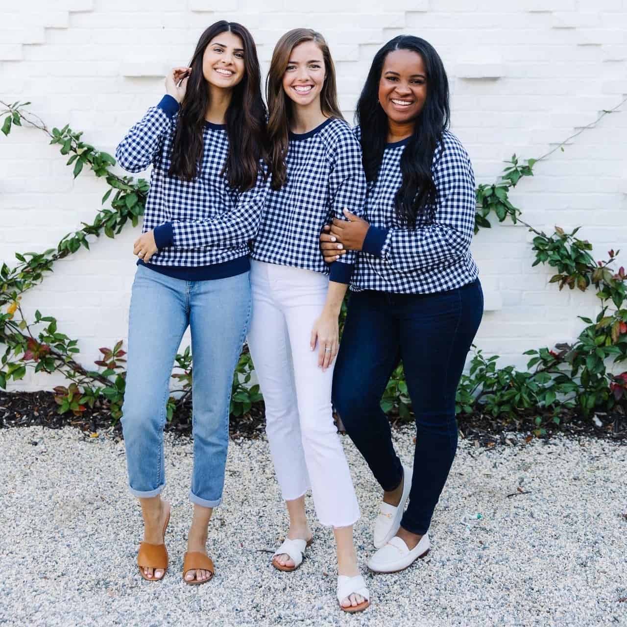 Behind The Scenes Draper James Trip by popular Dallas fashion blog, Glamorous Versatility: image of a three women wearing a Draper James blue gingham sweatshirts at The Park on Saint Simons Island.  