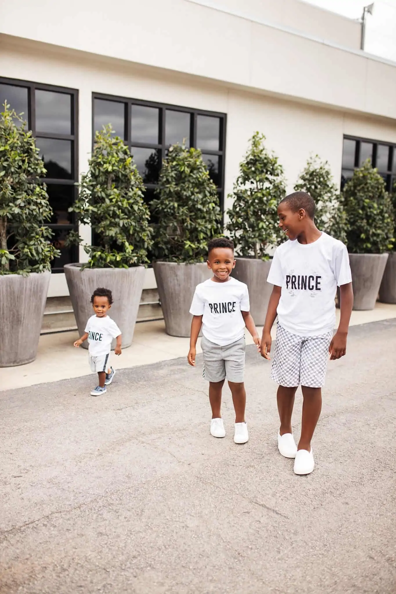 Home Building by popular Dallas lifestyle blog, Glamorous Versatility: image of three brothers walking together outside and wearing all white outfits. 