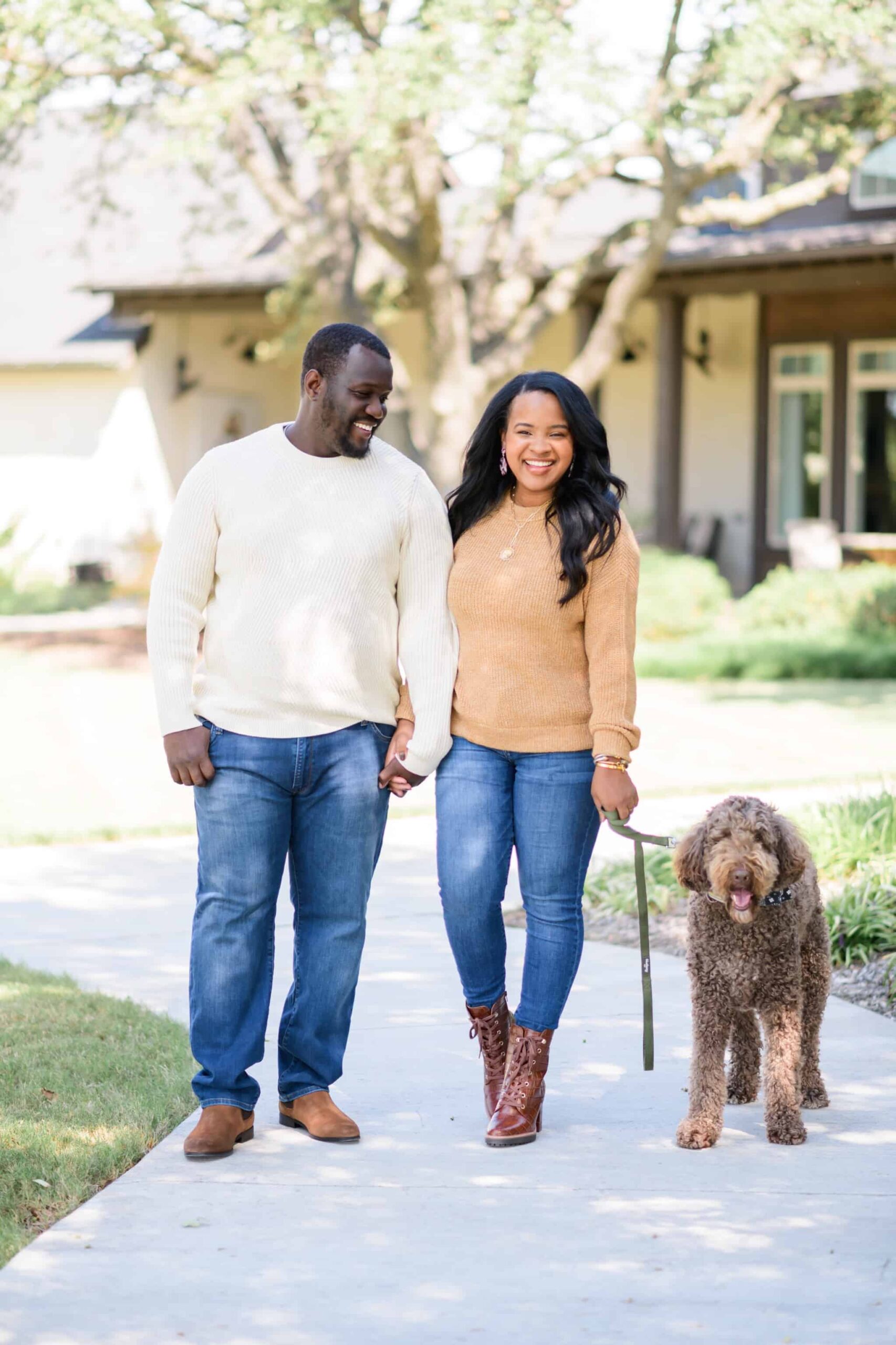 Get to Know by popular Dallas lifestyle blog, Glamorous Versatility: image of a husband and wife wearing Nordstrom Imagine Crewneck Sweater VERO MODA, Nordstrom Callie Platform Bootie NATURALIZER, Nordstrom Sarah Distressed Skinny Jeans ARTICLES OF SOCIETY, Nordstrom Chevron Ribbed Crewneck Sweater TOPMAN, Nordstrom 511™ Slim Tapered Jeans LEVI'S®, and Nordstrom Easton Water Resistant Chelsea Boot BP. while out walking their poodle breed dog. 