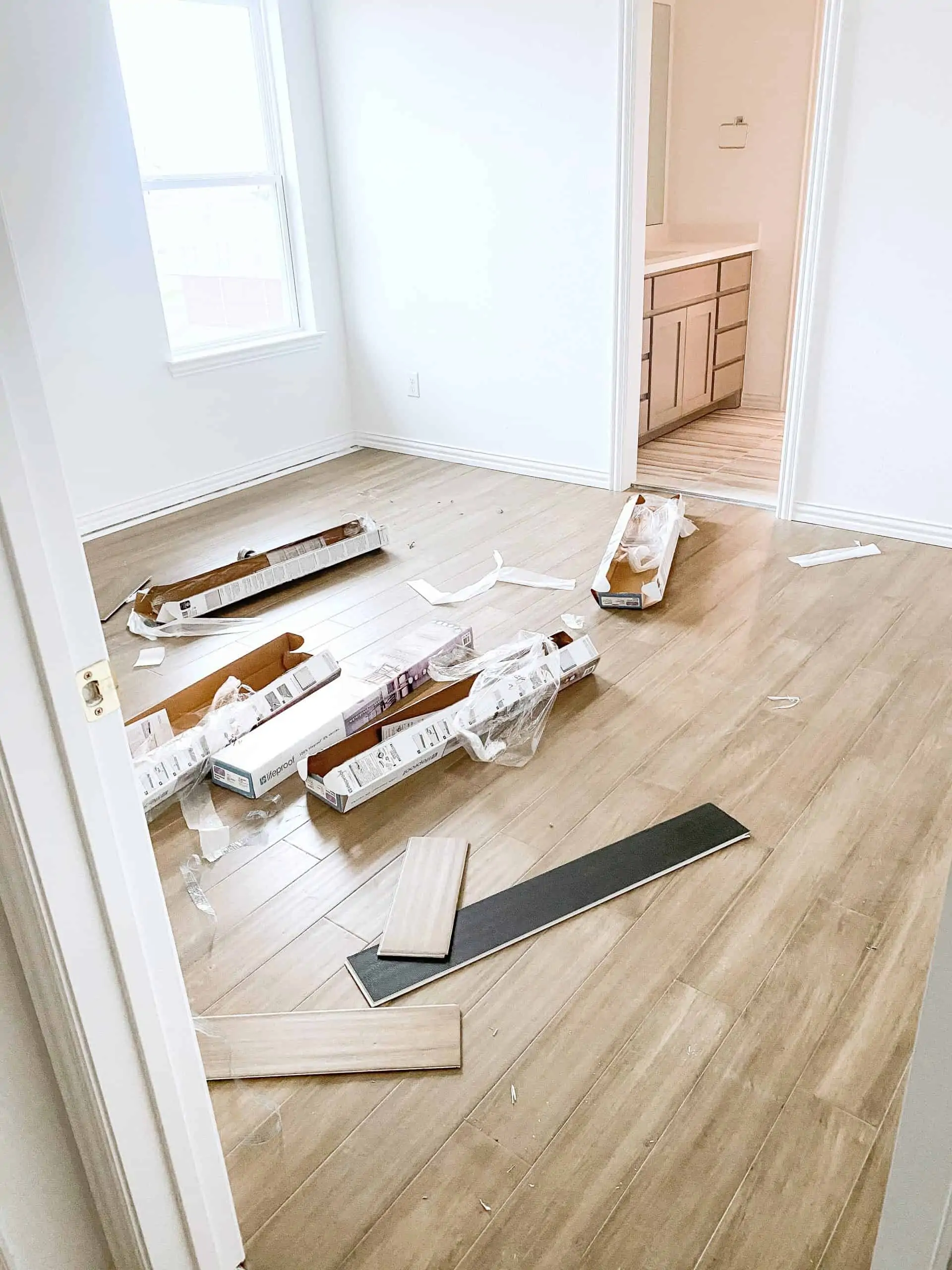Wood Floor Installation by popular Dallas life and style blog, Glamorous Versatility: image of light wood floors being installed in a boy's room. 